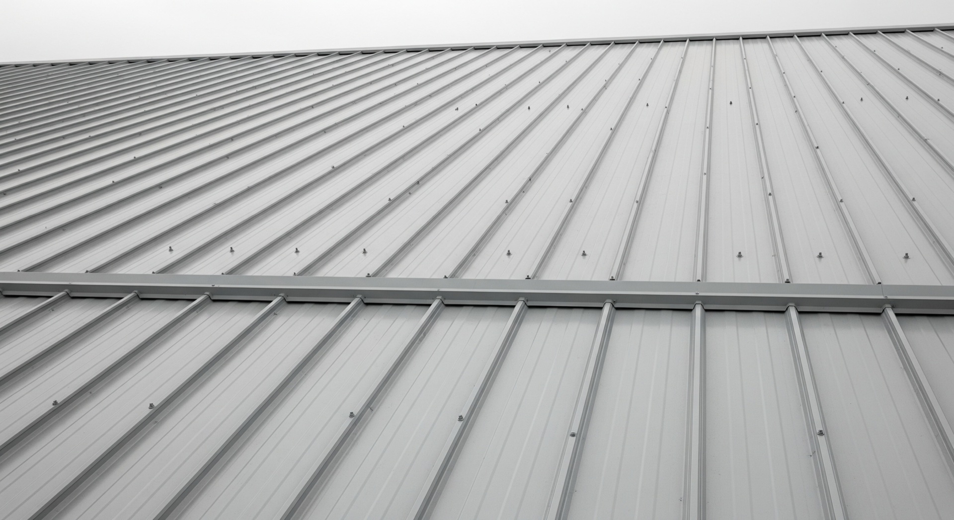 Box profile metal cladding with ridge flashing.